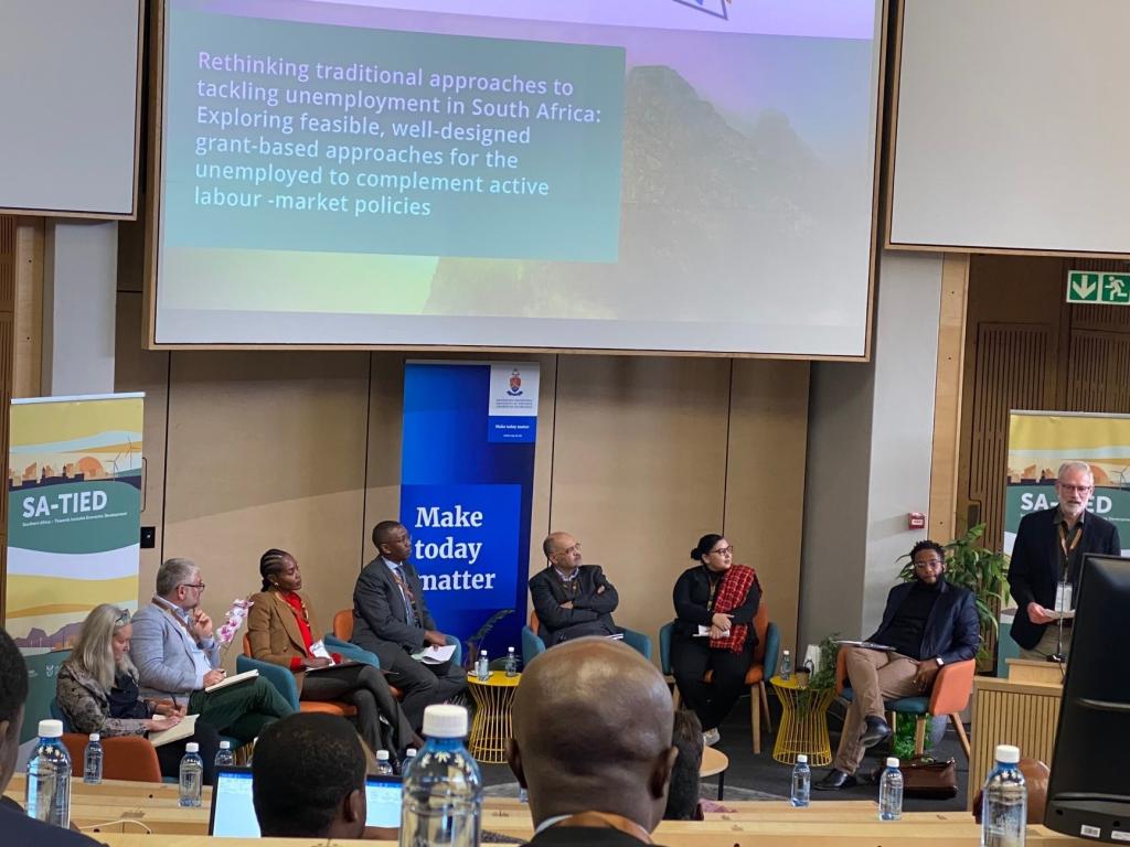 Image: The panelists at the policy dialogue. Credit: Haajirah Esau.